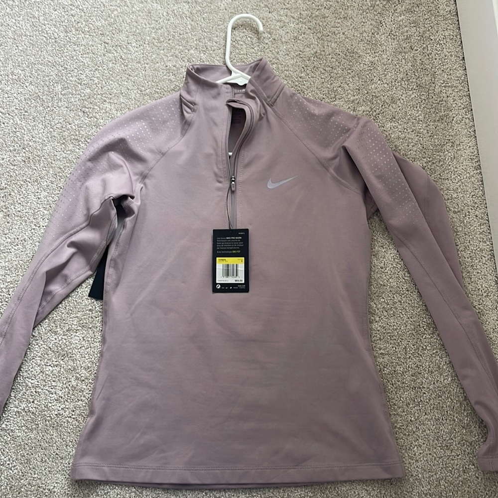 Women’s Nike Half Zip in a light purple.